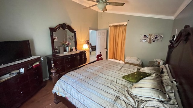 bedroom with dark wood-type flooring, ceiling fan, lofted ceiling, and ornamental molding