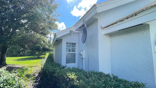 view of home's exterior with a yard