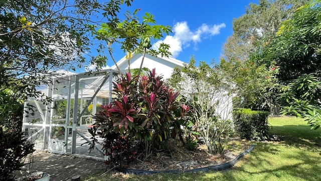 view of property exterior with a lawn