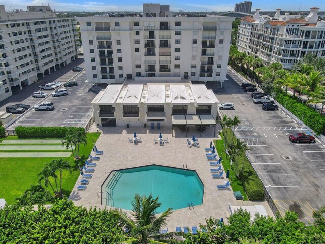 bird's eye view with a water view and a beach view