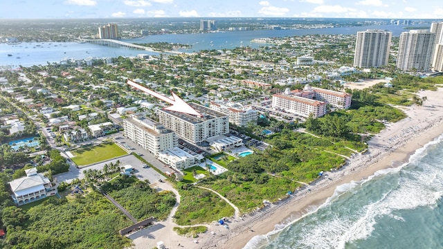 aerial view with a water view and a beach view