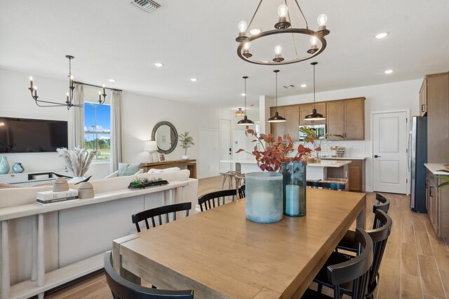 dining space featuring light hardwood / wood-style flooring