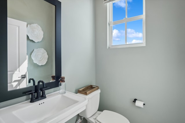 bathroom featuring sink and toilet