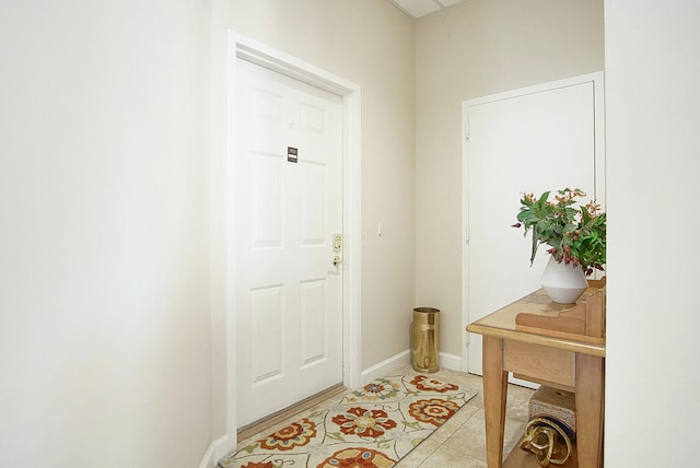 doorway to outside featuring light tile patterned floors