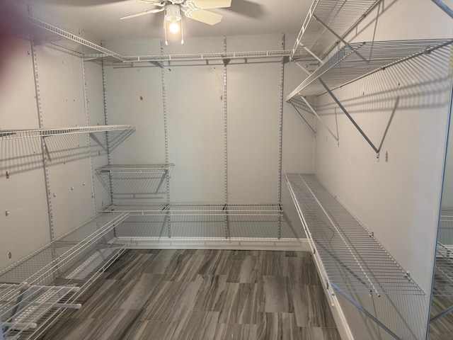 spacious closet featuring a ceiling fan