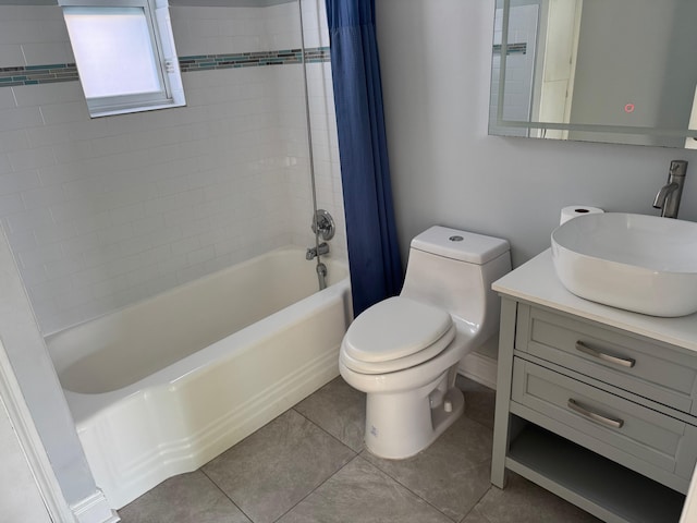 bathroom featuring tile patterned flooring, vanity, toilet, and shower / bath combo