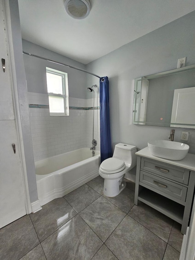 bathroom featuring toilet, shower / tub combo, tile patterned floors, and vanity