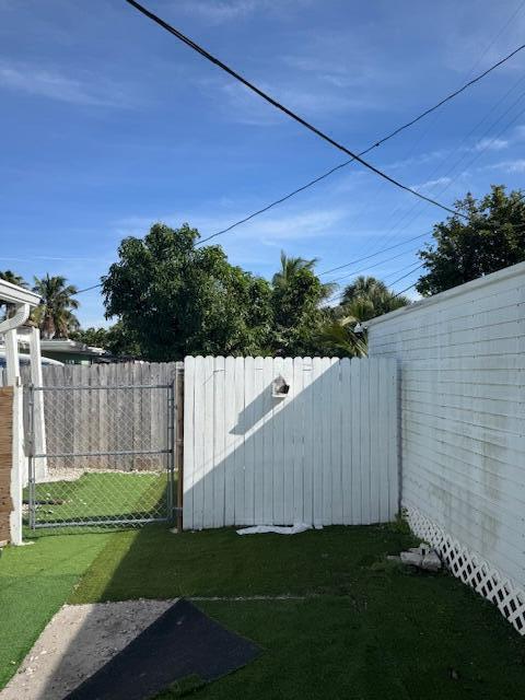 view of yard with a gate and fence