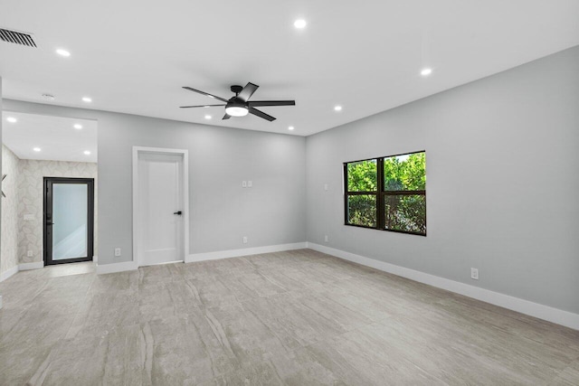 spare room with ceiling fan