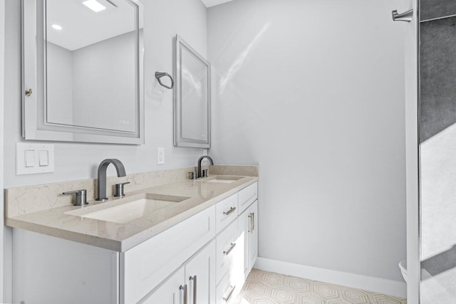 bathroom with vanity and tile patterned flooring