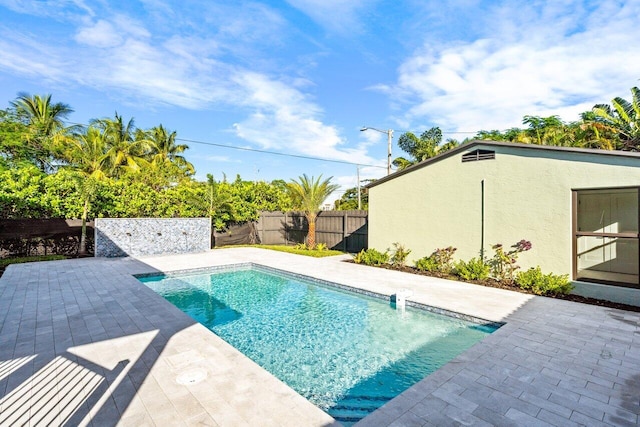 view of swimming pool with a patio area