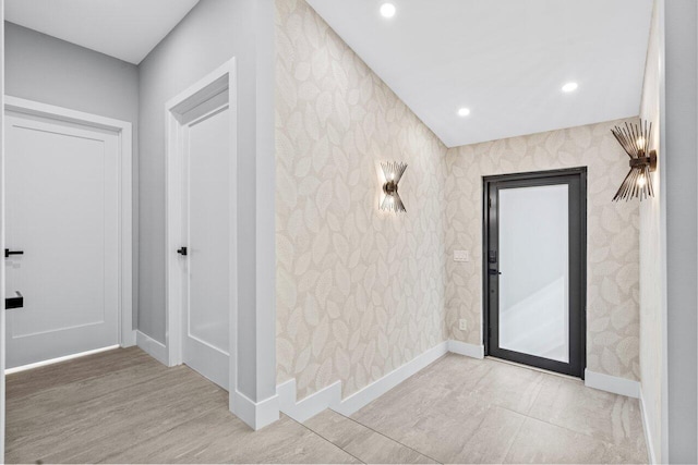 entryway with light hardwood / wood-style flooring