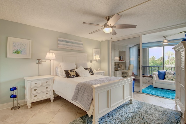 tiled bedroom with ceiling fan, a textured ceiling, and access to outside