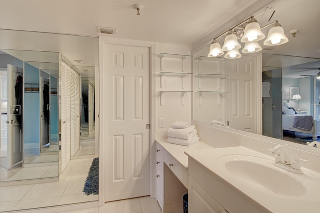 bathroom featuring tile patterned flooring and vanity