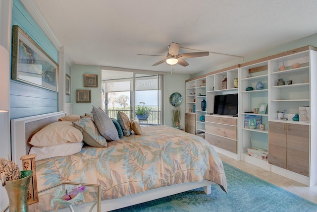 bedroom with a textured ceiling and ceiling fan