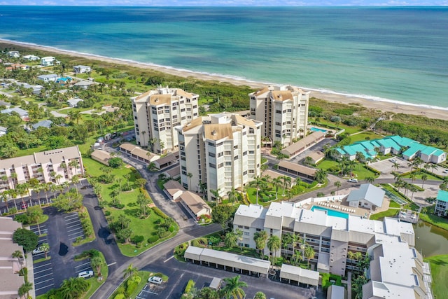 aerial view featuring a water view and a view of the beach