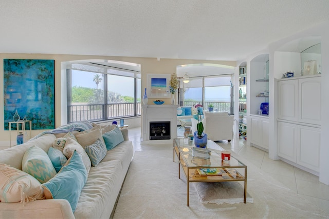 tiled living room with a textured ceiling