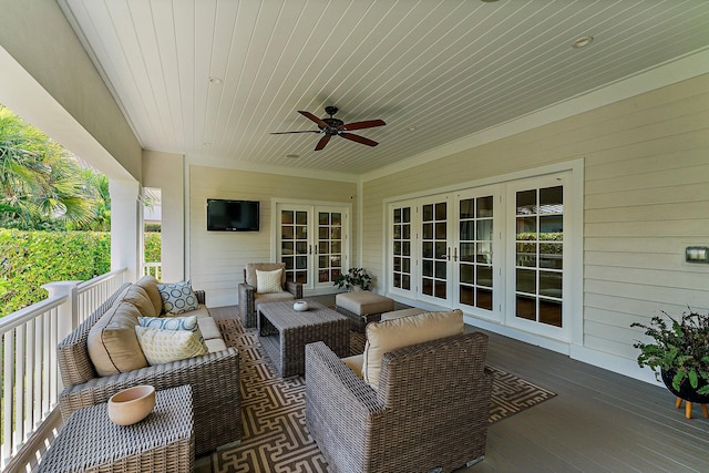 deck featuring outdoor lounge area and french doors