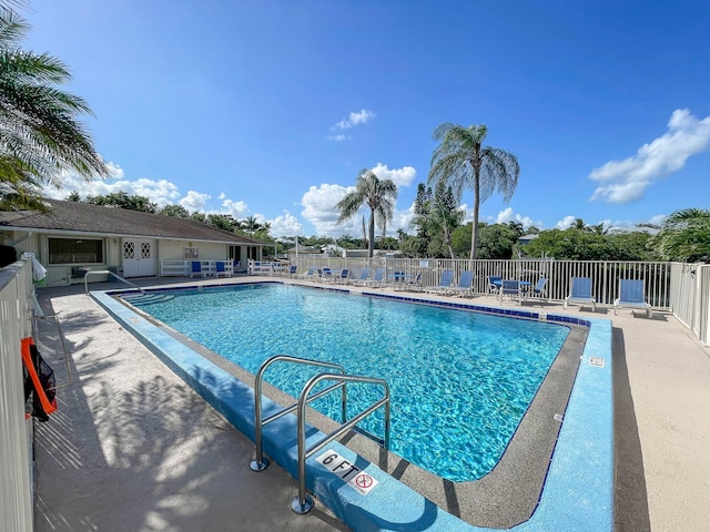 view of swimming pool with a patio