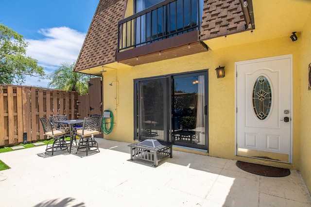 exterior space featuring a balcony and a patio area