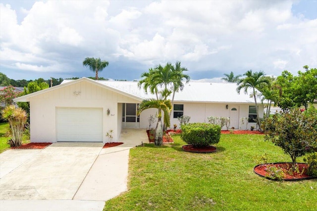 ranch-style home with a front lawn and a garage