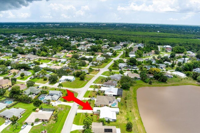 birds eye view of property featuring a water view