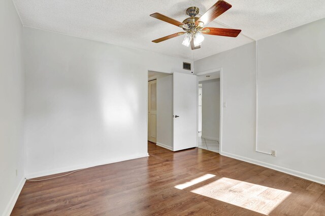 bathroom with visible vents, a closet, wood finished floors, and vanity