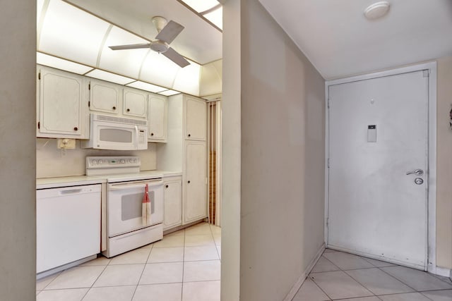 kitchen featuring ceiling fan, light countertops, white appliances, and light tile patterned floors