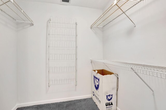 bathroom with a ceiling fan, a stall shower, vanity, and baseboards