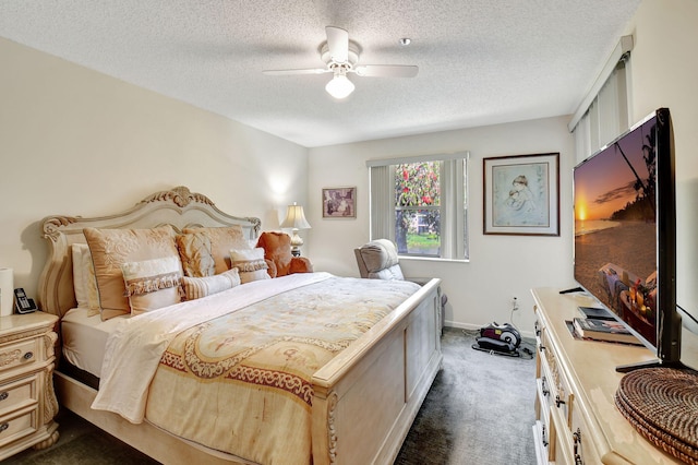 carpeted bedroom featuring ceiling fan and a textured ceiling