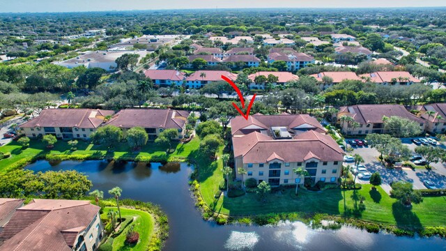 birds eye view of property featuring a water view