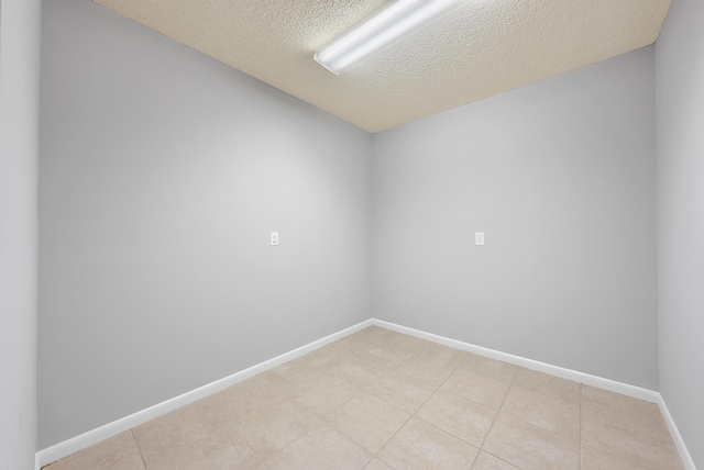 empty room featuring a textured ceiling