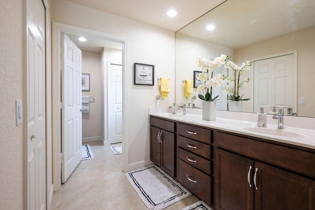 bathroom with vanity and tile patterned flooring