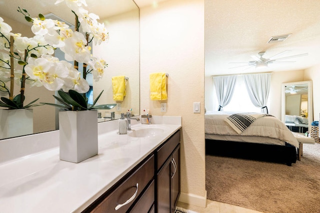 bathroom featuring vanity, tile patterned floors, and ceiling fan