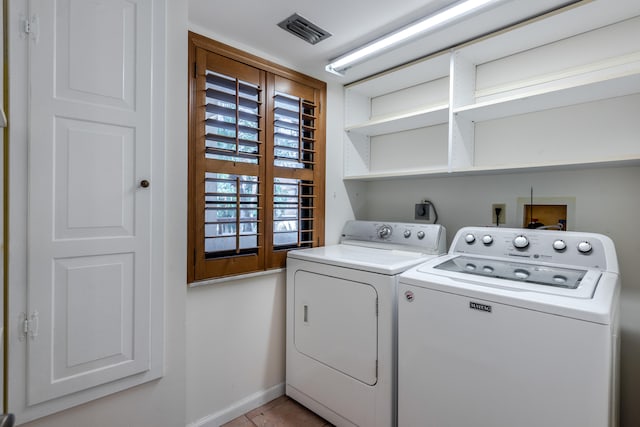 laundry area featuring washer and clothes dryer