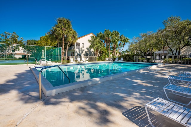 view of swimming pool with a patio area