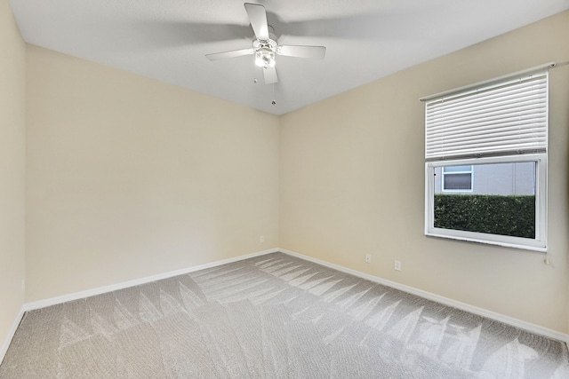 carpeted empty room with ceiling fan