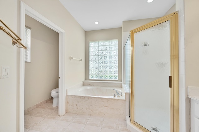 full bathroom featuring vanity, shower with separate bathtub, toilet, and tile patterned floors