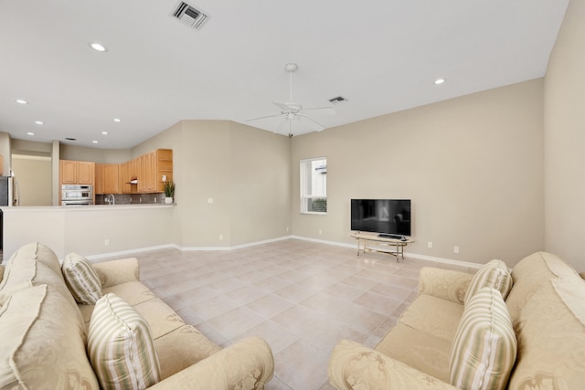 living room with light tile patterned flooring and ceiling fan