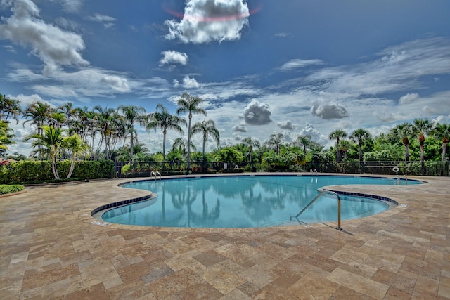 view of swimming pool featuring a patio area