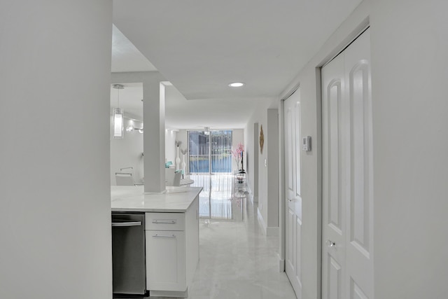 hall featuring marble finish floor