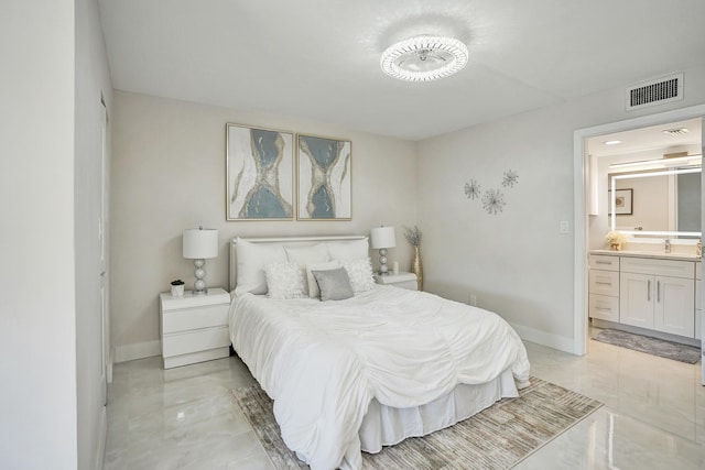 bedroom with sink and ensuite bath