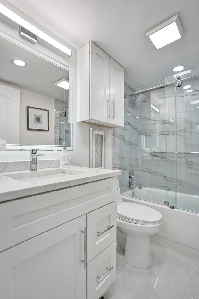 full bathroom with vanity, shower / bath combination with glass door, and toilet