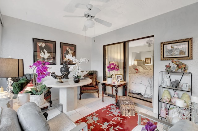 interior space featuring ceiling fan and light tile patterned floors