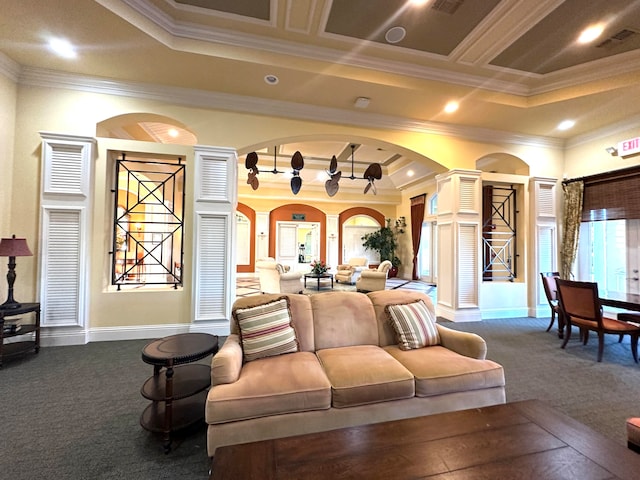 carpeted living room featuring a raised ceiling and crown molding