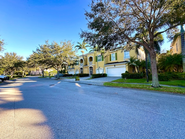 view of front of property with a garage