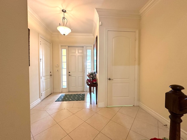 tiled foyer featuring crown molding