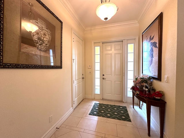 foyer featuring light tile patterned floors, crown molding, and a wealth of natural light