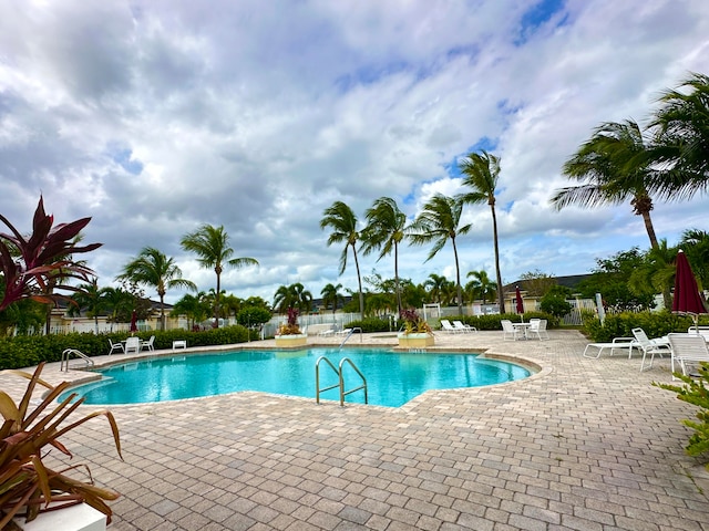 view of swimming pool featuring a patio area