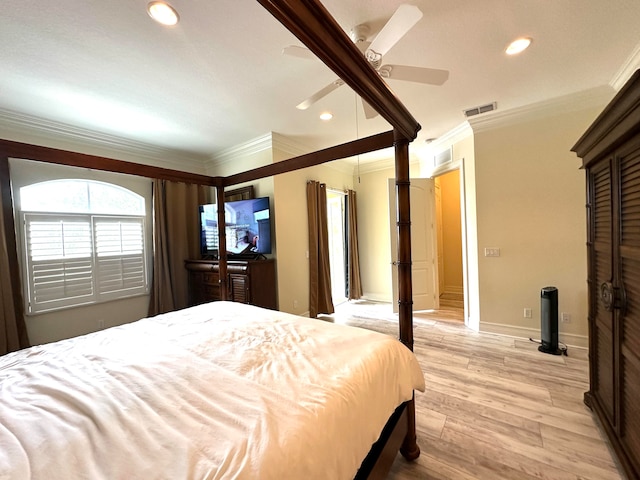 bedroom featuring ceiling fan, crown molding, and light hardwood / wood-style floors